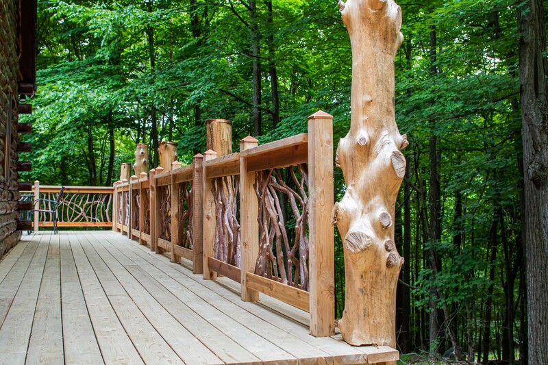 Live-edge undressed cedar logs were harvested to serve as the new deck columns. 