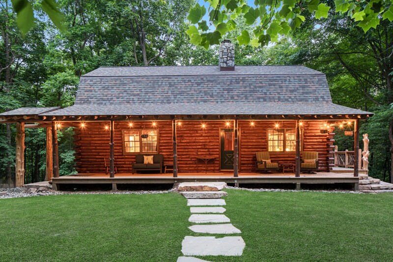 A stone walkway across the lawn leads to a new patio.